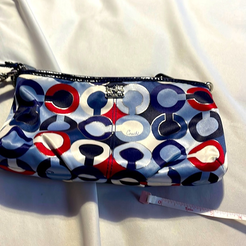 Blue multi monogrammed Coach wallet wristlet used a few times